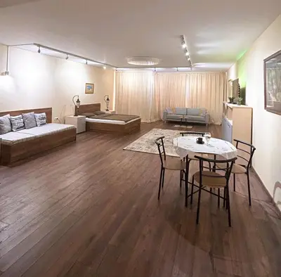 a large living room with a table and a couch at Zlati`s house 2 in Sofia