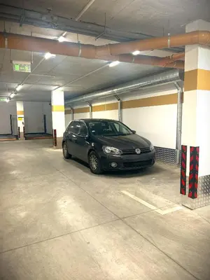 a car parked inside of a parking garage at Zlati`s house 2 in Sofia
