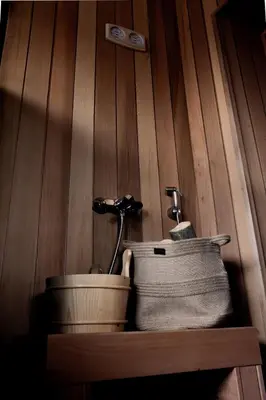 a wooden wall with a sink and a towel at Luxury House Veles in Hisarya