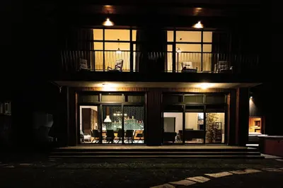 a night view of a house with a balcony at Luxury House Veles in Hisarya