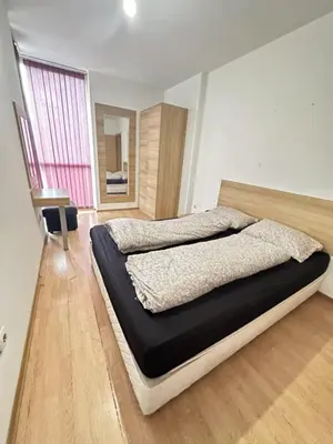 a bedroom with a large bed in a room at The Leverage in Sofia