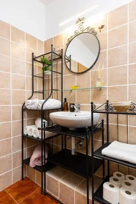 a bathroom with a sink and a mirror at Stancho's House 3BR apartment close to OLD TOWN & KAPANA district in Plovdiv