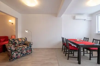 a living room with a dining room table and a couch at LZ Spacious One Bedroom Apartment in Top Centre by Flat Mаnager in Sofia