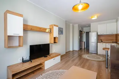 a living room with a flat screen tv on a wall at 1BD Apartment in Sofia City Center by Flat Mаnаger in Sofia
