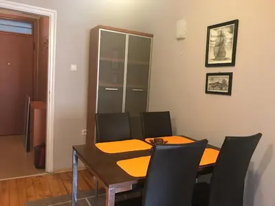 a dining room with a table and chairs at Beautiful Business Apartment - Ivan Denkoglu Street by Flat Mаnager in Sofia