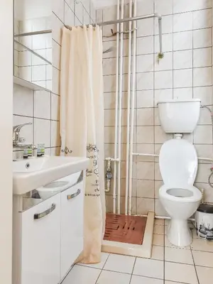 a bathroom with a toilet and a shower curtain at Historical Lion's Bridge 1-Bedroom Apartment by Flat Mаnager in Sofia