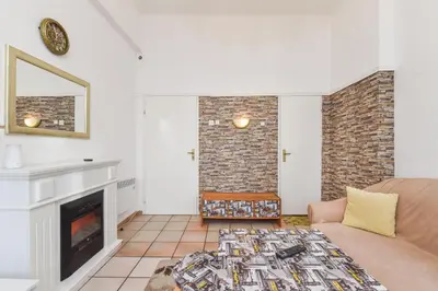 a living room with a couch and a fireplace at Historical Lion's Bridge 1-Bedroom Apartment by Flat Mаnager in Sofia