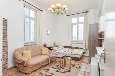 a living room with a couch and a table at Historical Lion's Bridge 1-Bedroom Apartment by Flat Mаnager in Sofia