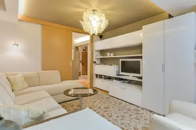 a living room with a couch and a tv at Stylish One-bedroom Flat with Amazing City View by Flat Mаnаger in Sofia