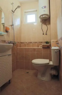 a bathroom with a toilet and a shower and a sink at Domus Magnolia Studio In The Top Center in Plovdiv