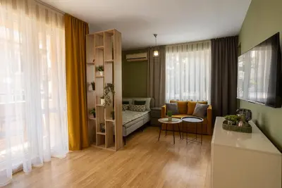 a living room with a couch and a table at Domus Magnolia Studio In The Top Center in Plovdiv