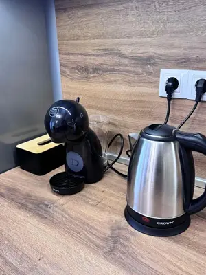 a tea pot and a tea kettle on a counter at Spacious sunny flat with 2 bedrooms in the heart of Plovdiv in Plovdiv