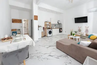 a living room with a couch and a table at Apartment Velik in Sandanski