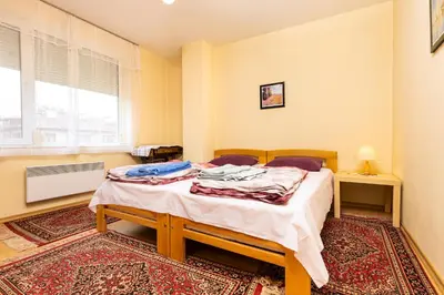 a bedroom with a bed in a room at Quiet apartment near the center by Flat Mаnager in Plovdiv