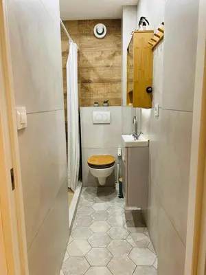 a small bathroom with a toilet and a sink at Casa Tiempo in Sofia