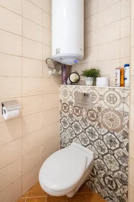a bathroom with a white toilet in a room at Studio Talisman V in Sofia
