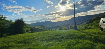 a car parked on the side of a grassy hill at Комплекс Арда in Arda