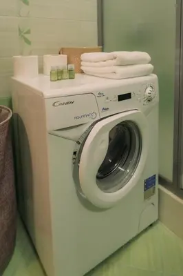 a washing machine with towels on top of it at Apartment Aria 5 in Velingrad
