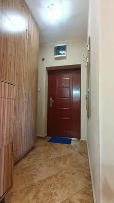 a hallway with a red door and a door sidx sidx sidx at Malina Apart in Plovdiv