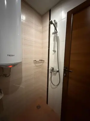 a bathroom with a shower with a shower head at Green View Studios in Sandanski