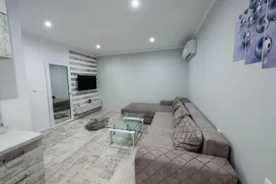 a living room with a couch and a table at Secret Guest House in Plovdiv