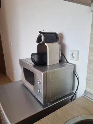 a printer sitting on top of a microwave at Ski & View Pamporovo Apartment in Smolyan