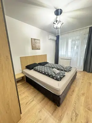 a bedroom with a bed in a room at The View Residences & private parking in Sofia