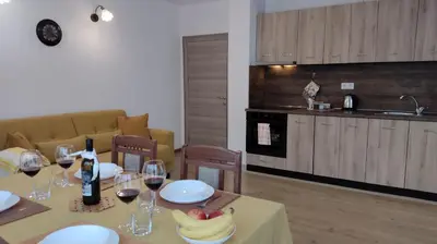 a kitchen with a table with glasses of wine at Sofia Harmony Tranquility Comfort and Free Parking in Sofia
