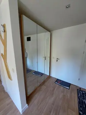 an empty room with a large mirror and wood floors at Apartment B5 5 Relax Chamkoria Borovets in Borovets