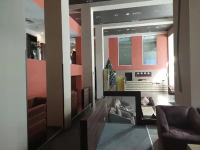 a living room with pink walls and a couch at Apartment B5 5 Relax Chamkoria Borovets in Borovets