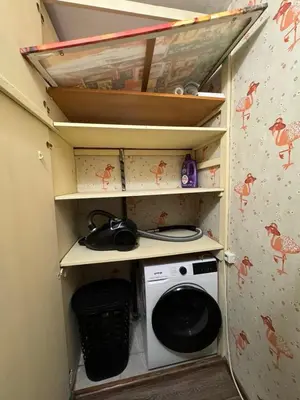a laundry room with a washing machine in it at Cozy Corner in Nadezhda in Sofia