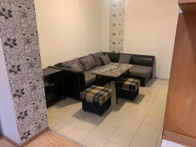a living room with a couch and a table at West Park Retreat in Sofia