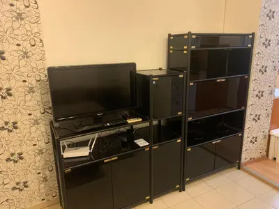 a black entertainment center with a flat screen tv at West Park Retreat in Sofia
