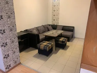 a living room with a couch and a table at West Park Retreat in Sofia