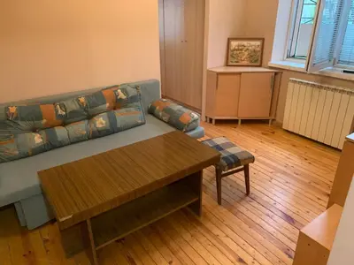 a living room with a couch and a coffee table at West Park Retreat in Sofia