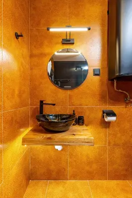 a bathroom with a sink and a mirror at Plovdiv Urban Gem 2BD Apartment by Flat Mаnаger in Plovdiv