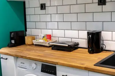 a kitchen counter top with a coffee maker and a toaster at Saltwater Apartments in Sandanski