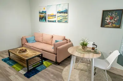 a living room with a couch and a table at Saltwater Apartments in Sandanski