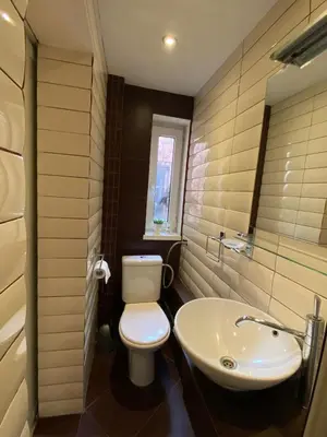 a bathroom with a white toilet and a sink at Sofia Central Cozy Apartment in Sofia