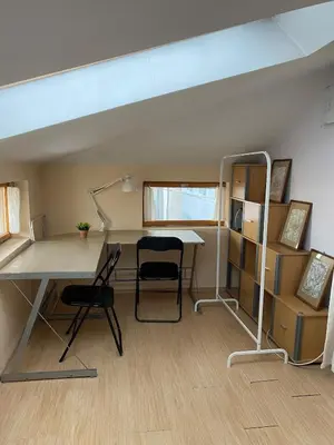 a room with a desk and a table and chairs at Sofia Central Cozy Apartment in Sofia