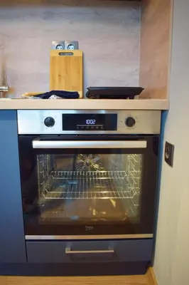 a kitchen with an oven with its door open at Studio 42 Plovdiv in Plovdiv