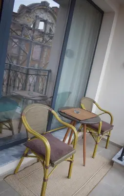 two chairs and a table on a balcony at Studio 42 Plovdiv in Plovdiv