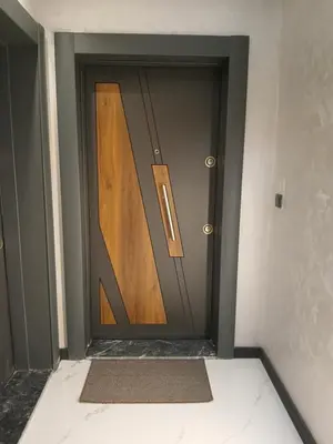a wooden door in a room with a mat at Studio 42 Plovdiv in Plovdiv