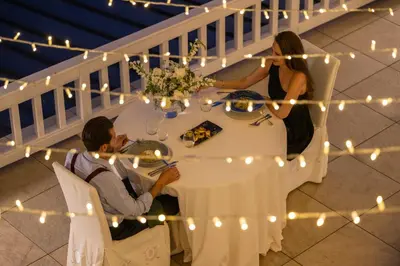 a man and a woman sitting at a table at Saint Sofia Golf Club, Hotel and SPA in Robertowo