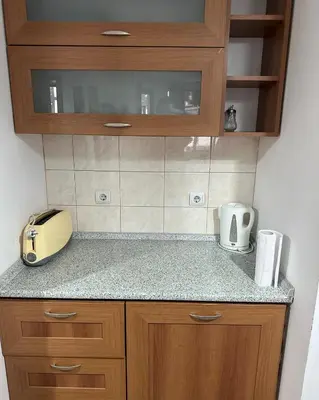 a kitchen with a counter top with a toaster on it at Ski Lift Apartment in Bansko