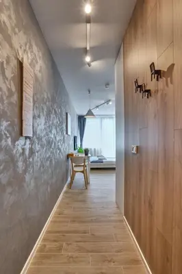 a hallway with a wooden wall and a table at Toronto Cozy Studio near UNSS and NSA w Fast WiFi in Sofia