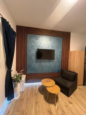a living room with a couch and a table at BoxRoom3 in Kyustendil