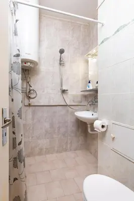 a bathroom with a shower and a toilet and a sink at 1-Bedroom Flat with Balcony in Plovdiv by Flat Mаnager in Plovdiv