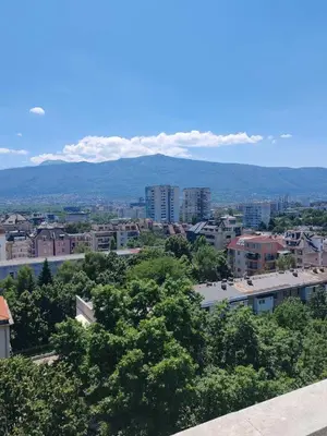a view of a city with mountains in the background at Апартамент Sofia View in Sofia