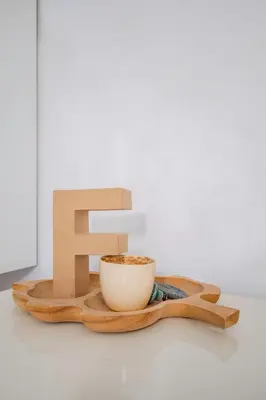 a letter f next to a cup of coffee at Bright and Cozy 1BD Apartment plus Desk by Flat Mаnаger in Sofia